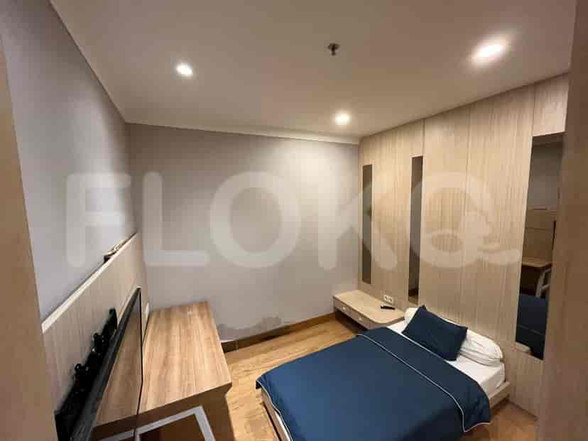 A second bedroom showcases a bed, a TV, and wardrobe with mirrors.