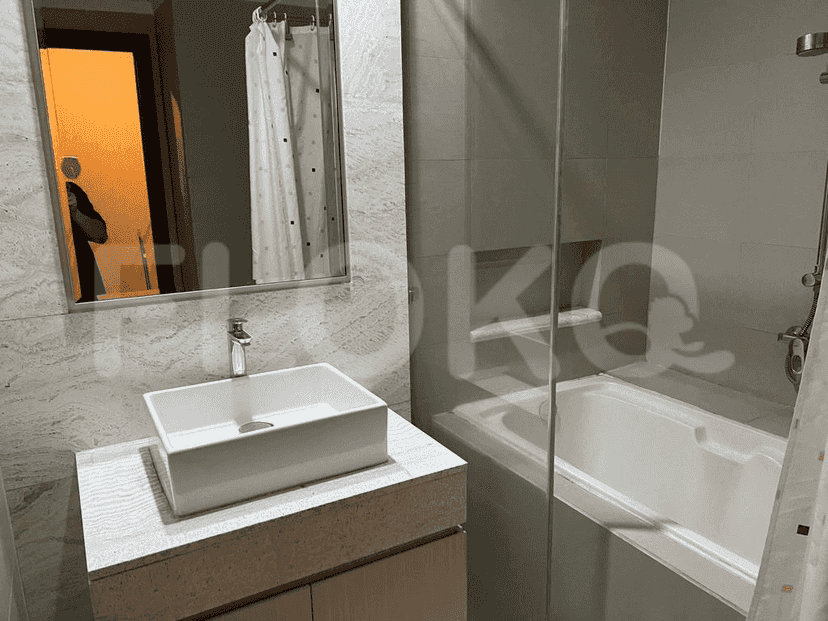 Modern bathroom with a sink, bathtub, and shower.