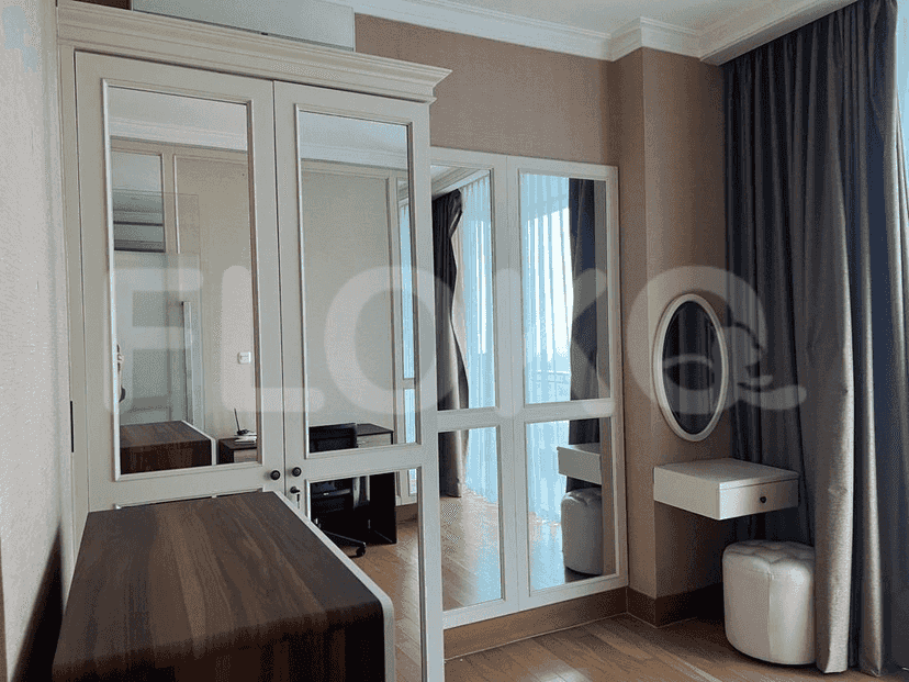 Wardrobe with a built-in mirror and a study area.