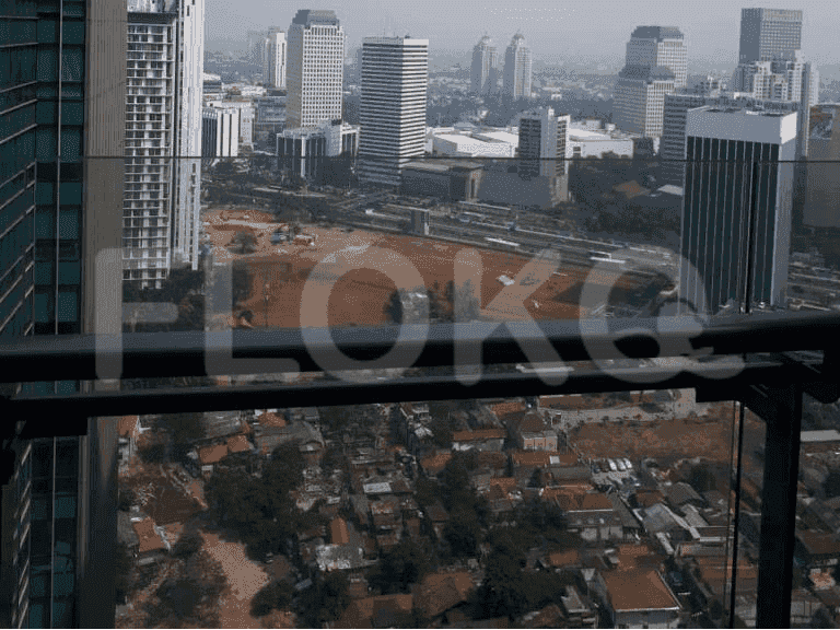 A high-angle view of a cityscape with a combination of residential and commercial buildings.
