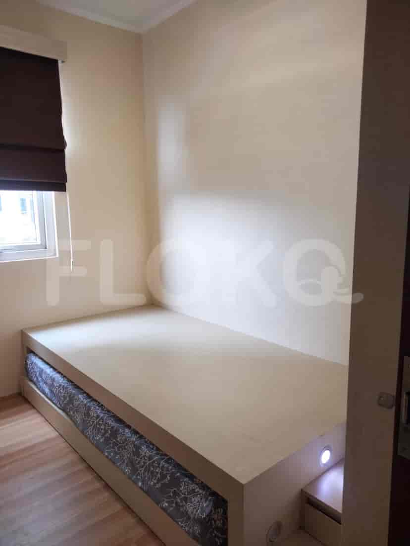 A bedroom with a bed.