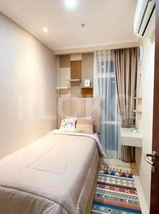 Small bedroom with a single bed and minimalist design.