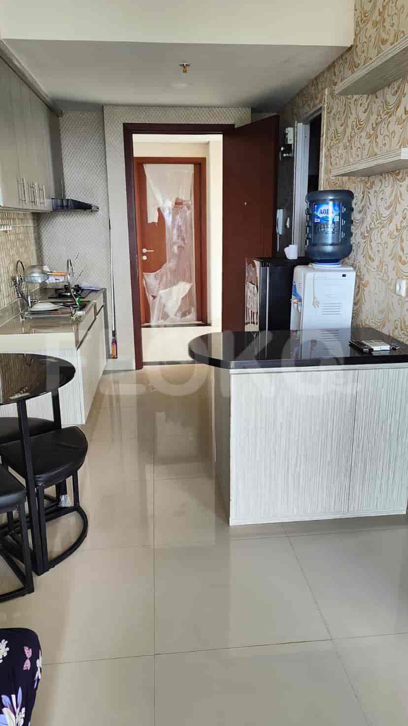 A compact kitchen with dining area.