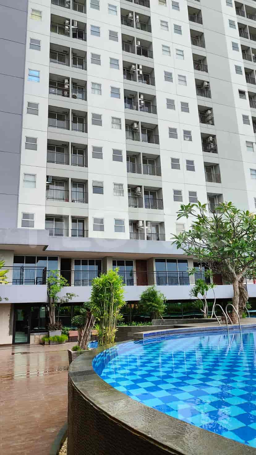 Building exterior with a pool.