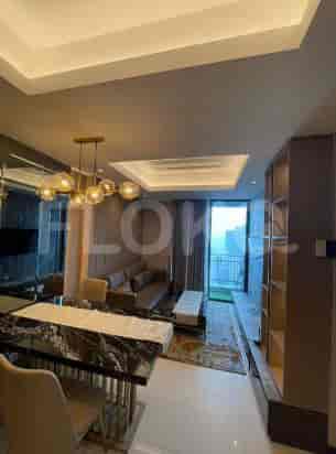 A dining room combined with the living area. A modern setup with a marble table.