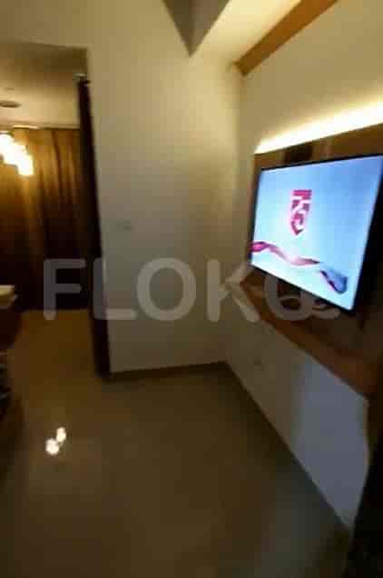 An interior view highlighting a television mounted on a wall.