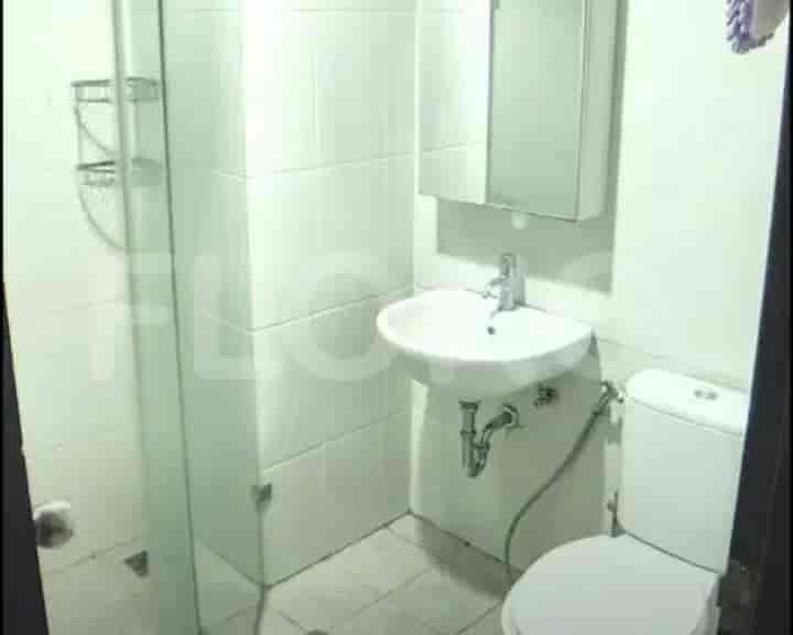 Clean bathroom with a shower and a sink with a mirror.