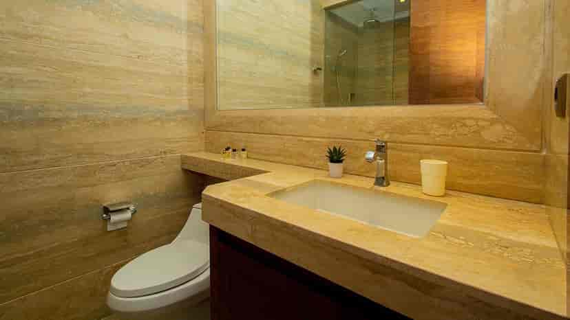 A bathroom with a sink and toilet.