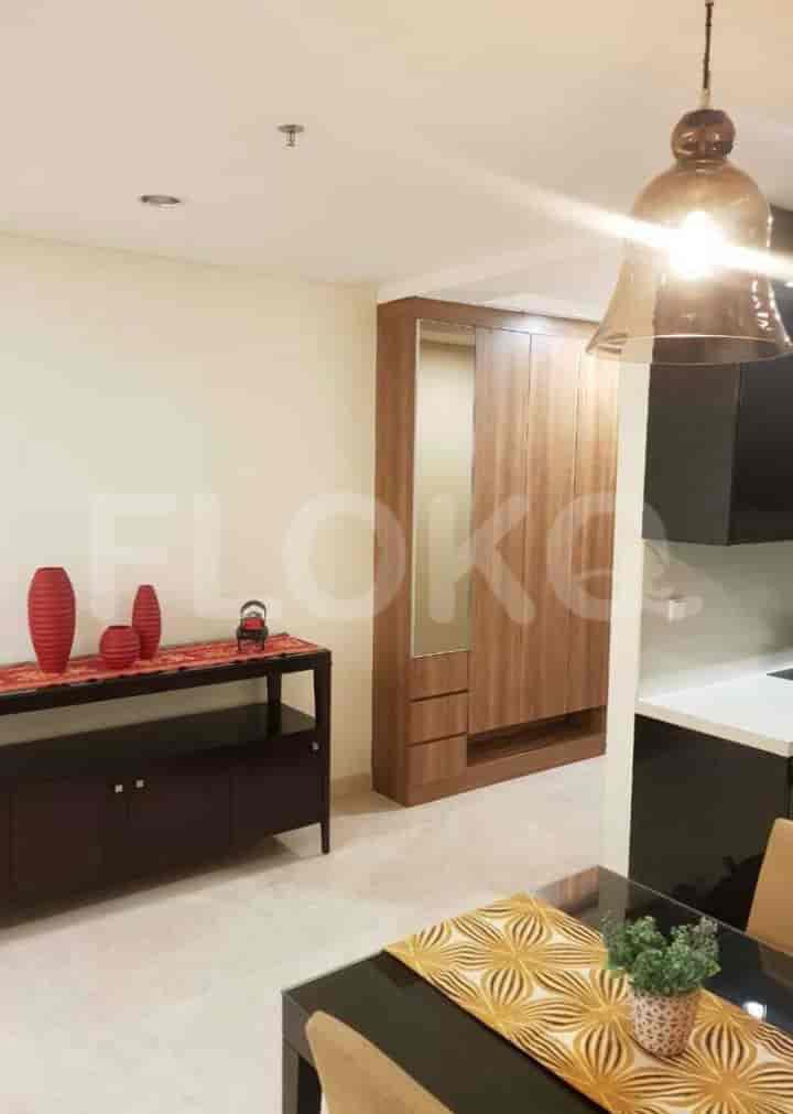A hallway or dining space with a console table and wardrobe.