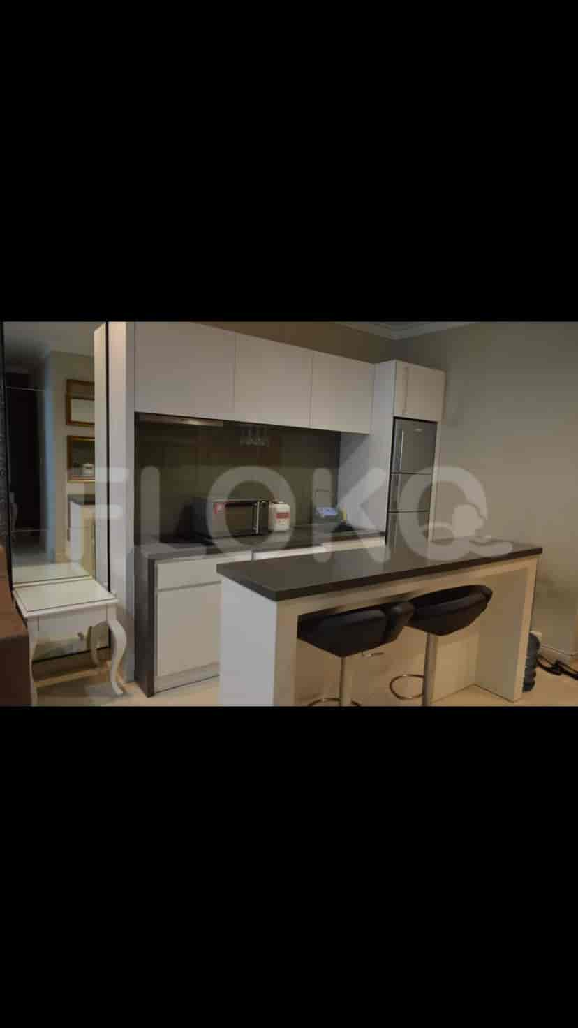 Modern kitchen with a breakfast bar and stools.