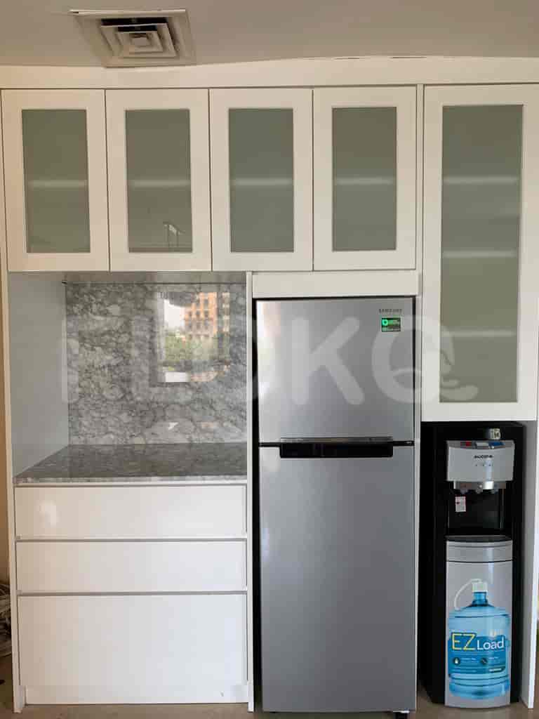 Kitchen with refrigerator and storage.