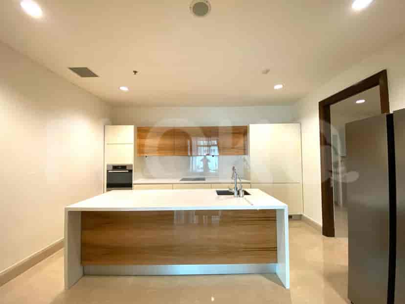 Modern kitchen with a central island, wooden cabinets, and white countertops.