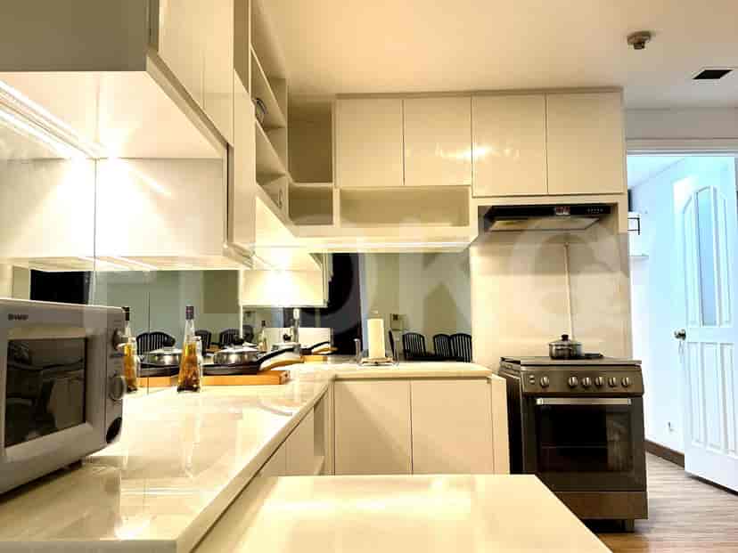 Another view of the white kitchen, showcasing the layout.