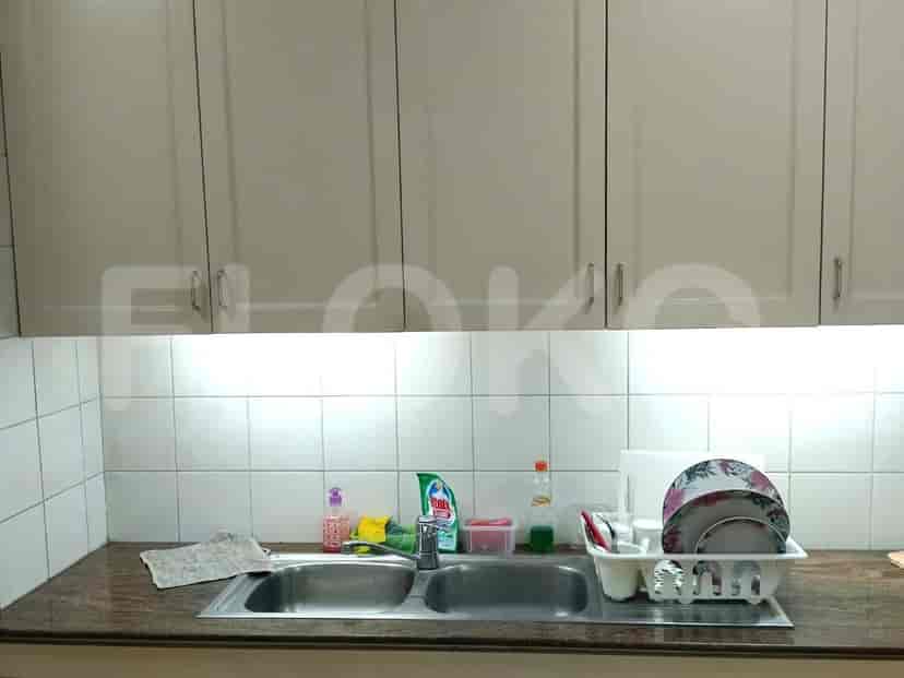 Kitchen with cabinets, a sink and appliances.