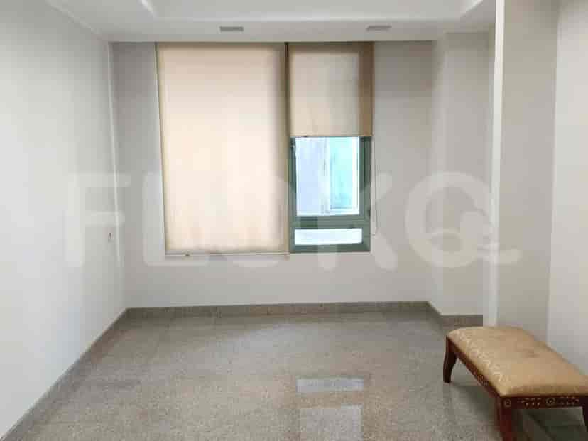 Bedroom with a window, blinds and a bench.