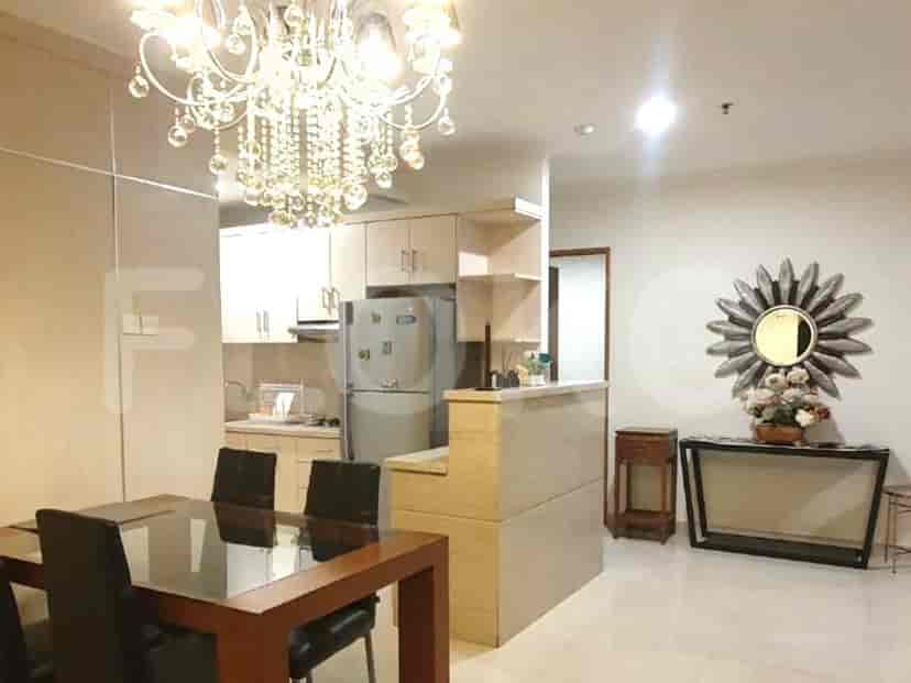 A combined kitchen and dining area with modern appliances and cabinetry.