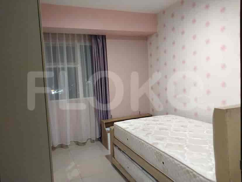 Bedroom with a double bed, a dresser, and a curtain.