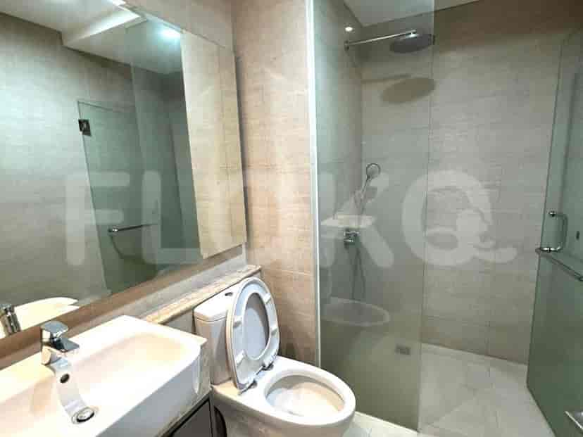 A bathroom with a shower and a mirror.