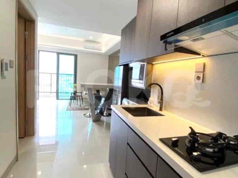 Kitchen with access to a balcony and dining area.