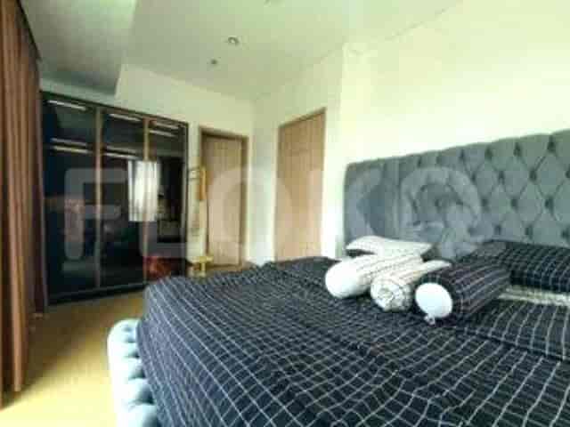 Elegant bedroom with a large bed, nightstands, and ample closet space.