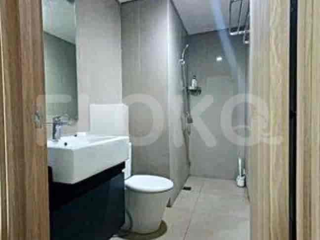 Modern bathroom with a shower, toilet, and a vanity.