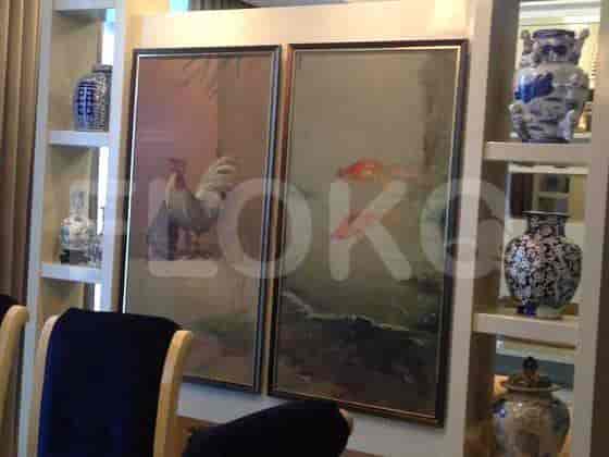 Dining area featuring artwork and decorative items.