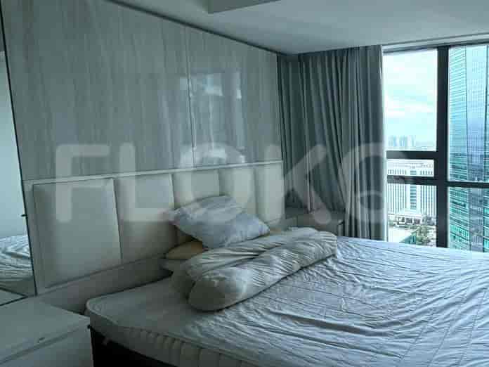 A second bedroom with a modern design and a large bed.