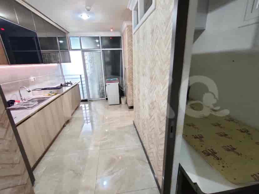 Another view of the kitchen, showing cabinets and counter space.