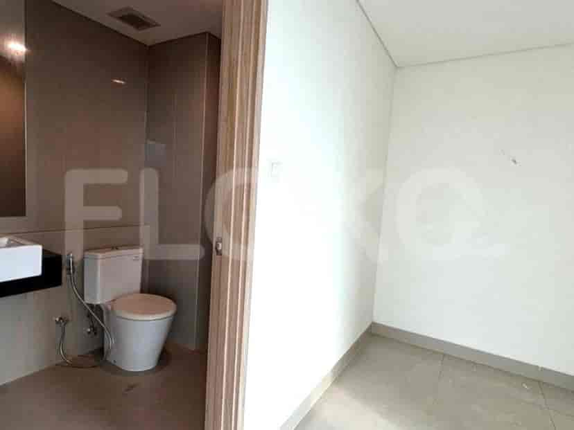 A small bathroom with toilet and sink.