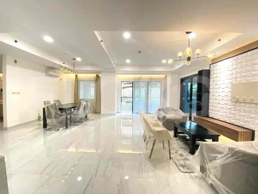 Spacious living and dining area with marble flooring, multiple light fixtures, and a balcony.
