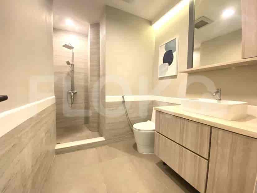 Bathroom with neutral tones, modern fixtures, and a shower.