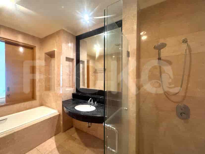 A bathroom with a bathtub, sink and shower.