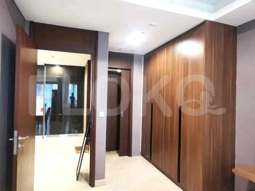 A master bedroom showing a large closet and door to an ensuite.