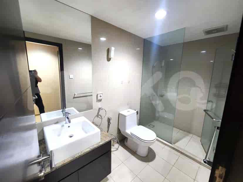 A bathroom with a glass shower and modern design.