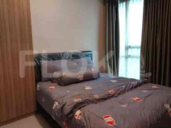 Bedroom with a double bed, wardrobe, and patterned bedding.