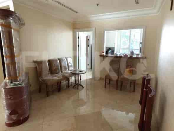 A living room with a sofa and table.