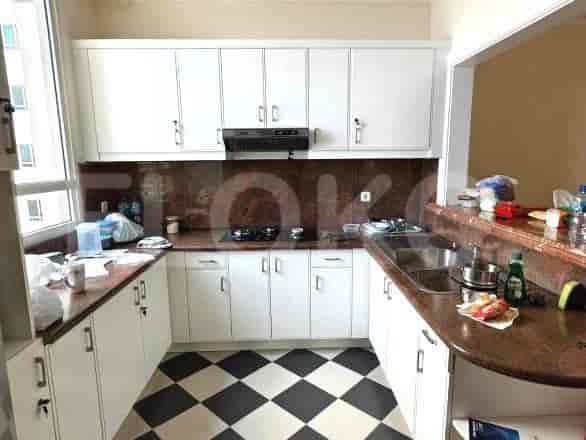 A kitchen with cabinets and a stove.