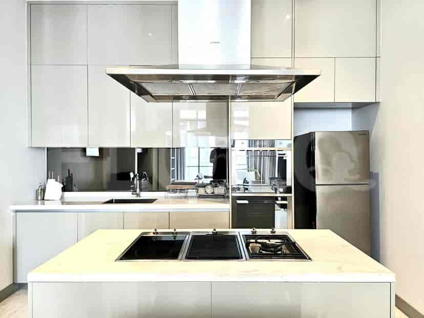 Modern kitchen with an island and stainless steel appliances.
