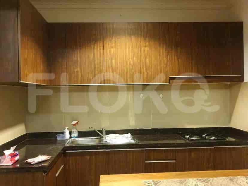 Modern kitchen with wooden cabinets and granite countertops.