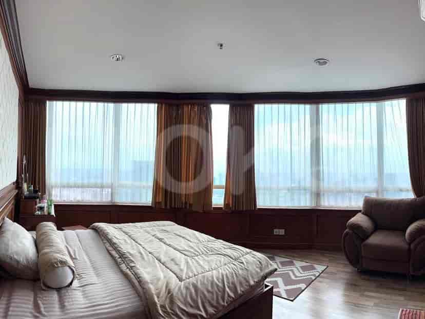 Another bedroom with large windows.