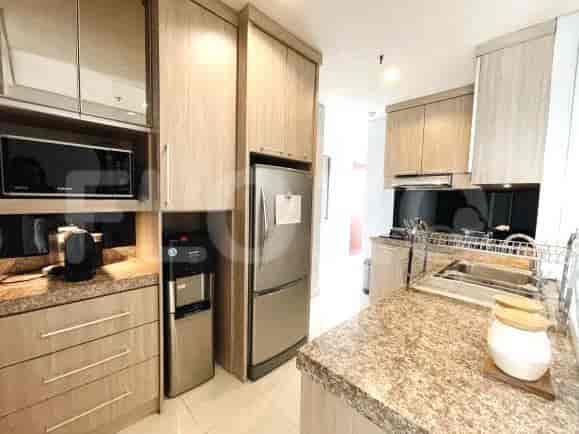 A modern kitchen with stainless steel appliances and ample cabinet space.