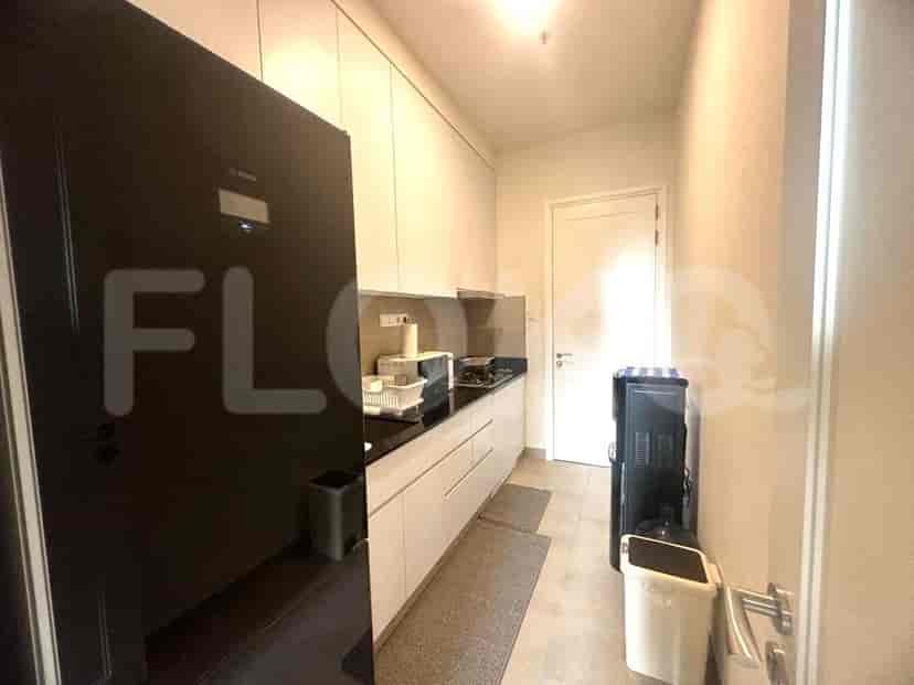 Modern kitchen with appliances and storage.