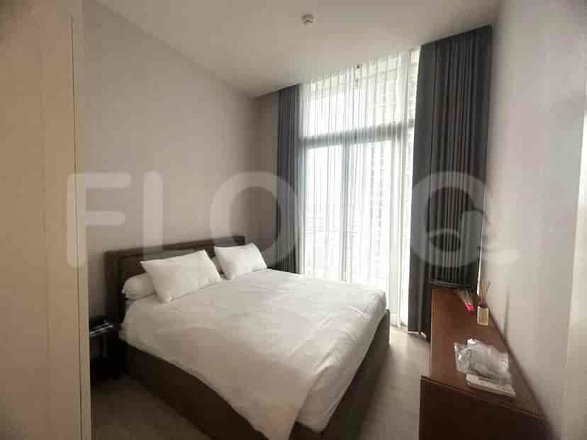 Bedroom with a large bed and window.