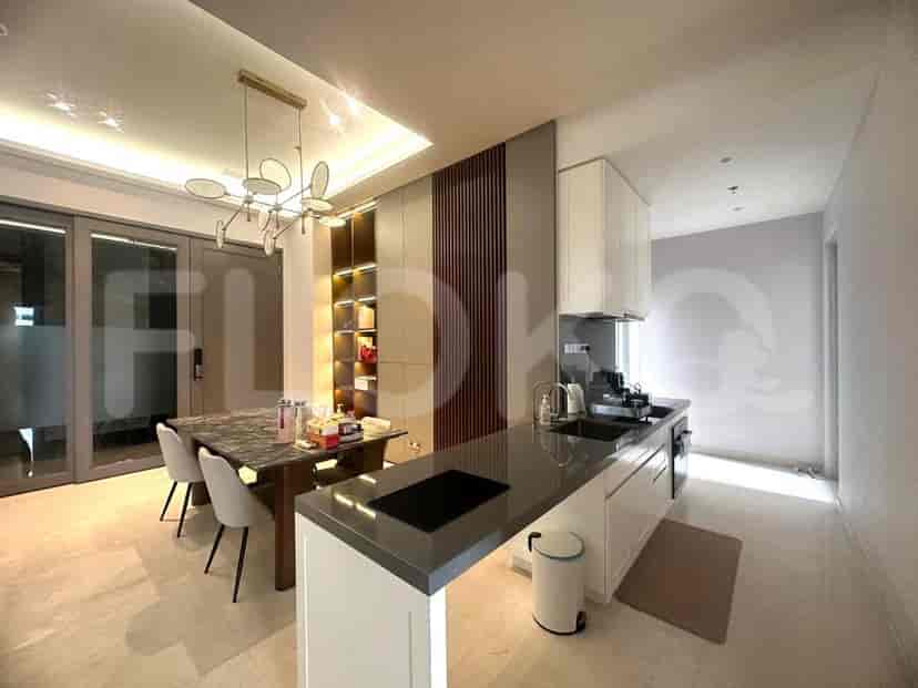 View of kitchen, dining area and living area.