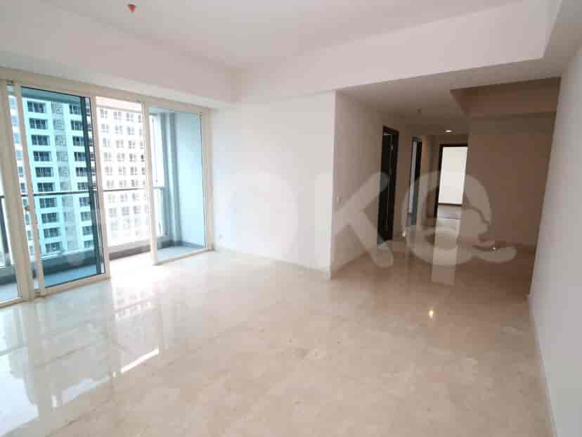 Bright living area with marble flooring, balcony access, and city views.