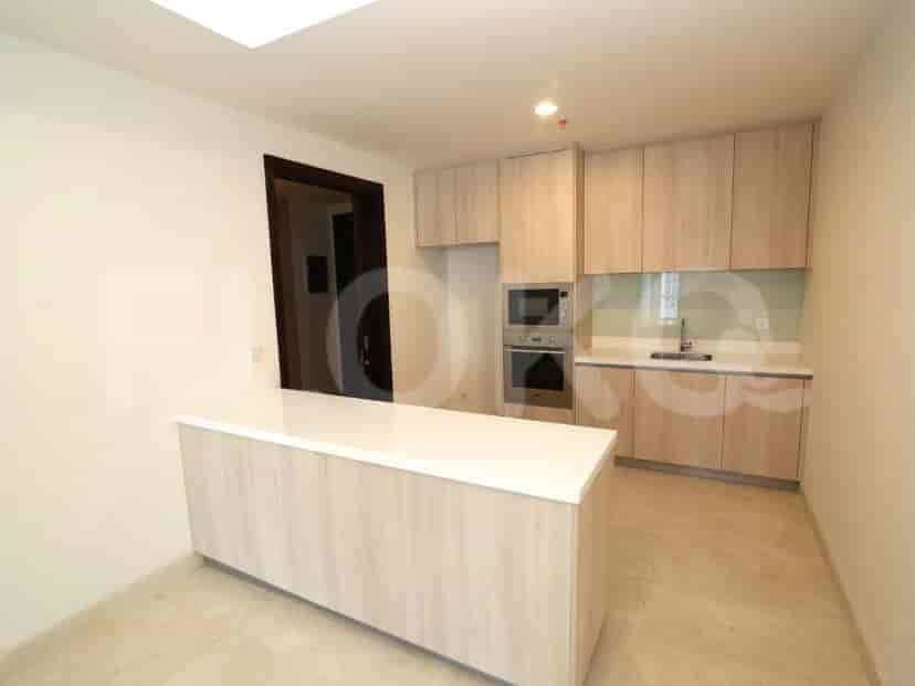 Modern kitchen with light-colored cabinetry and a breakfast bar.