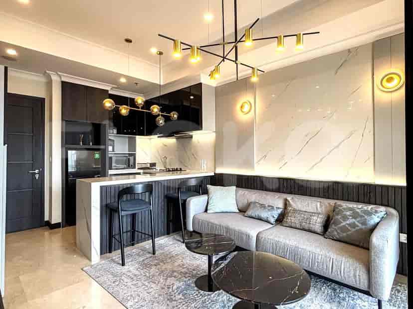 A modern living and dining area featuring a marble countertop kitchen island, grey sofa, and elegant lighting fixtures.