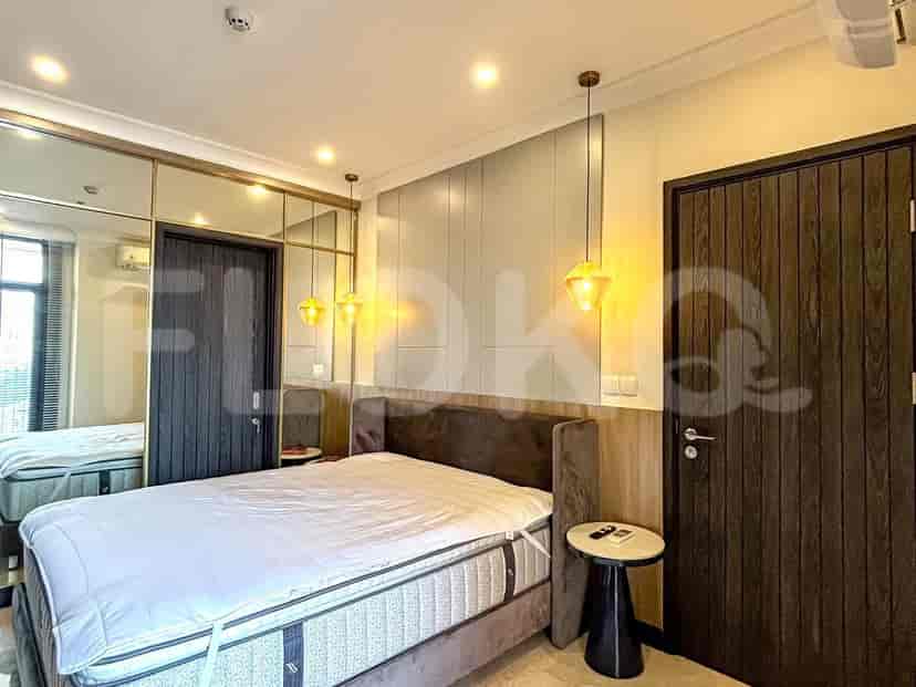 A bedroom featuring a single bed with an adjacent window, a closet, and modern design.