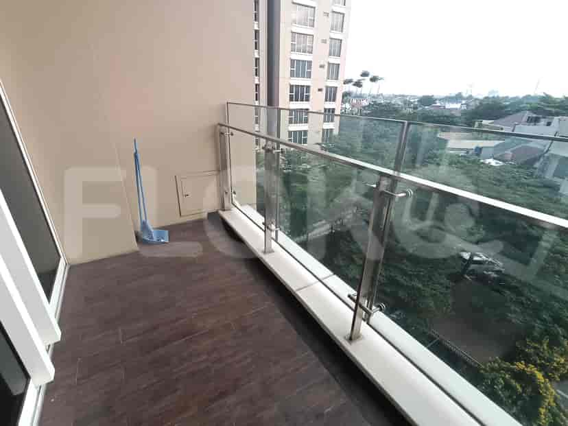 A balcony with a view of the city.