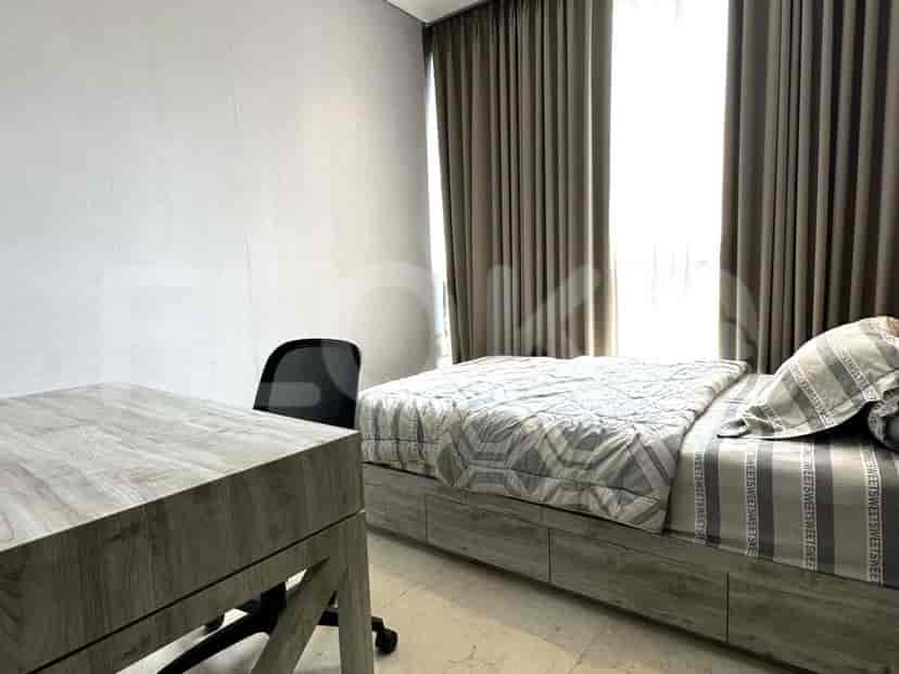 Bedroom with a bed and a desk.